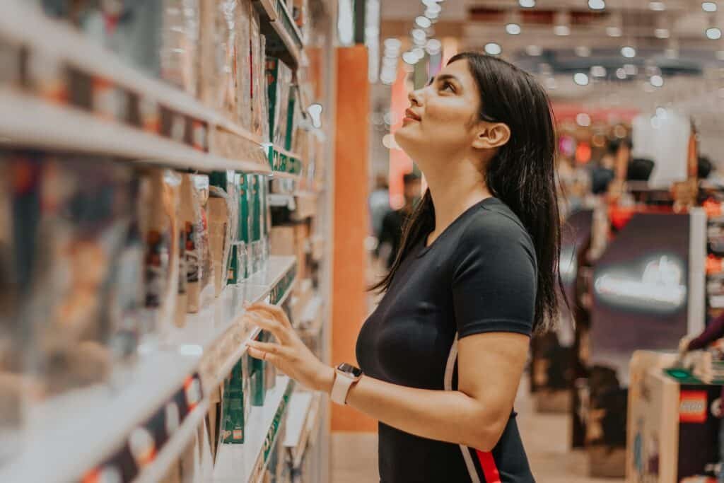 a woman looking at a shelf